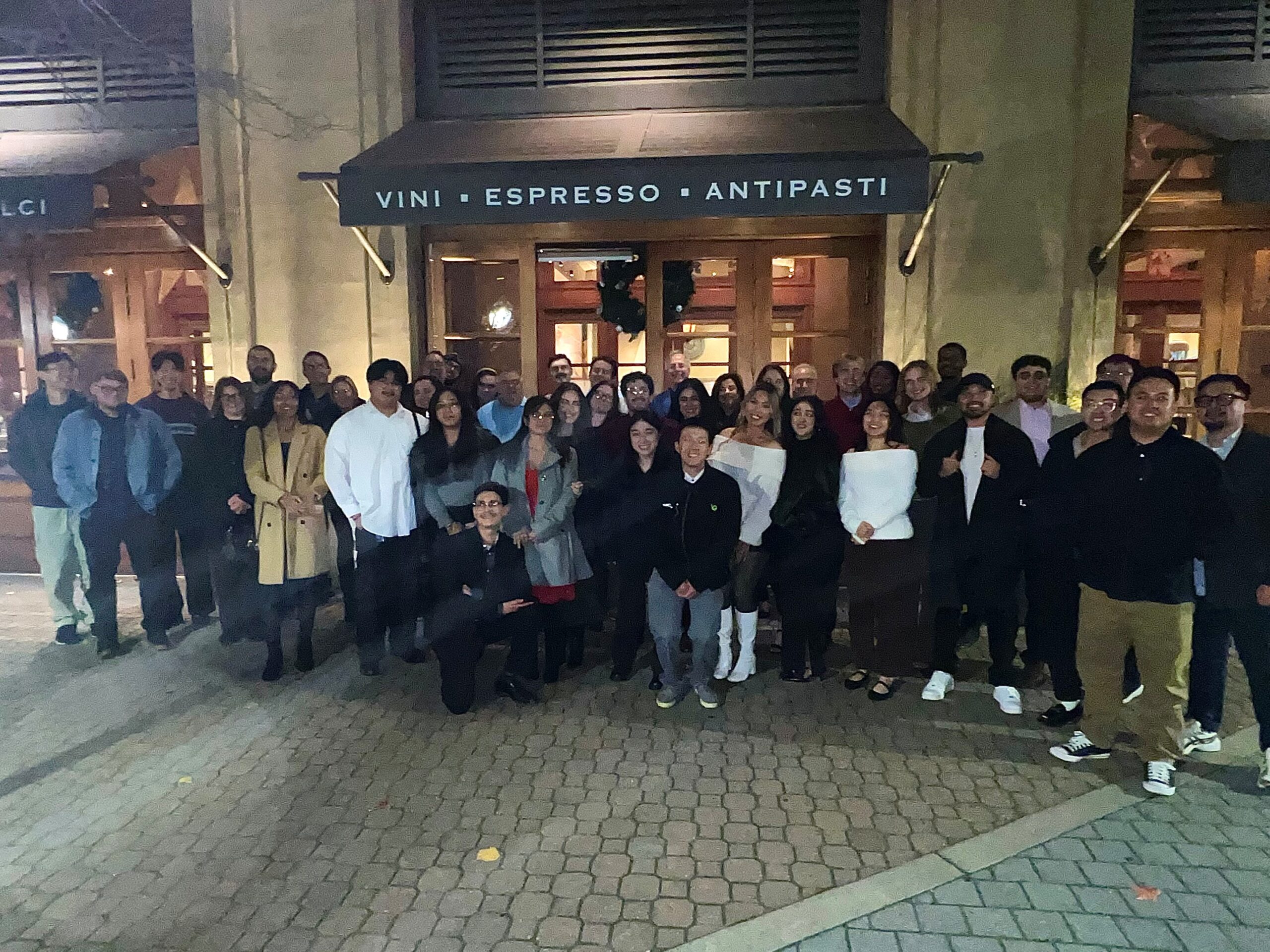 The PC Professional team standing outside a restaurant.