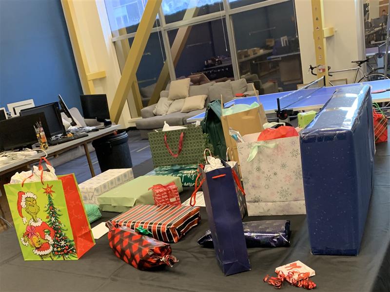 A table filled with White Elephant gifts